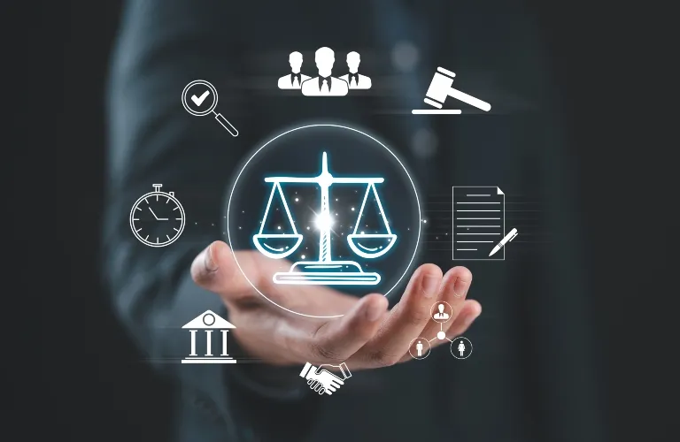 Hand holding digital icons representing justice, law, time, and collaboration on dark background.